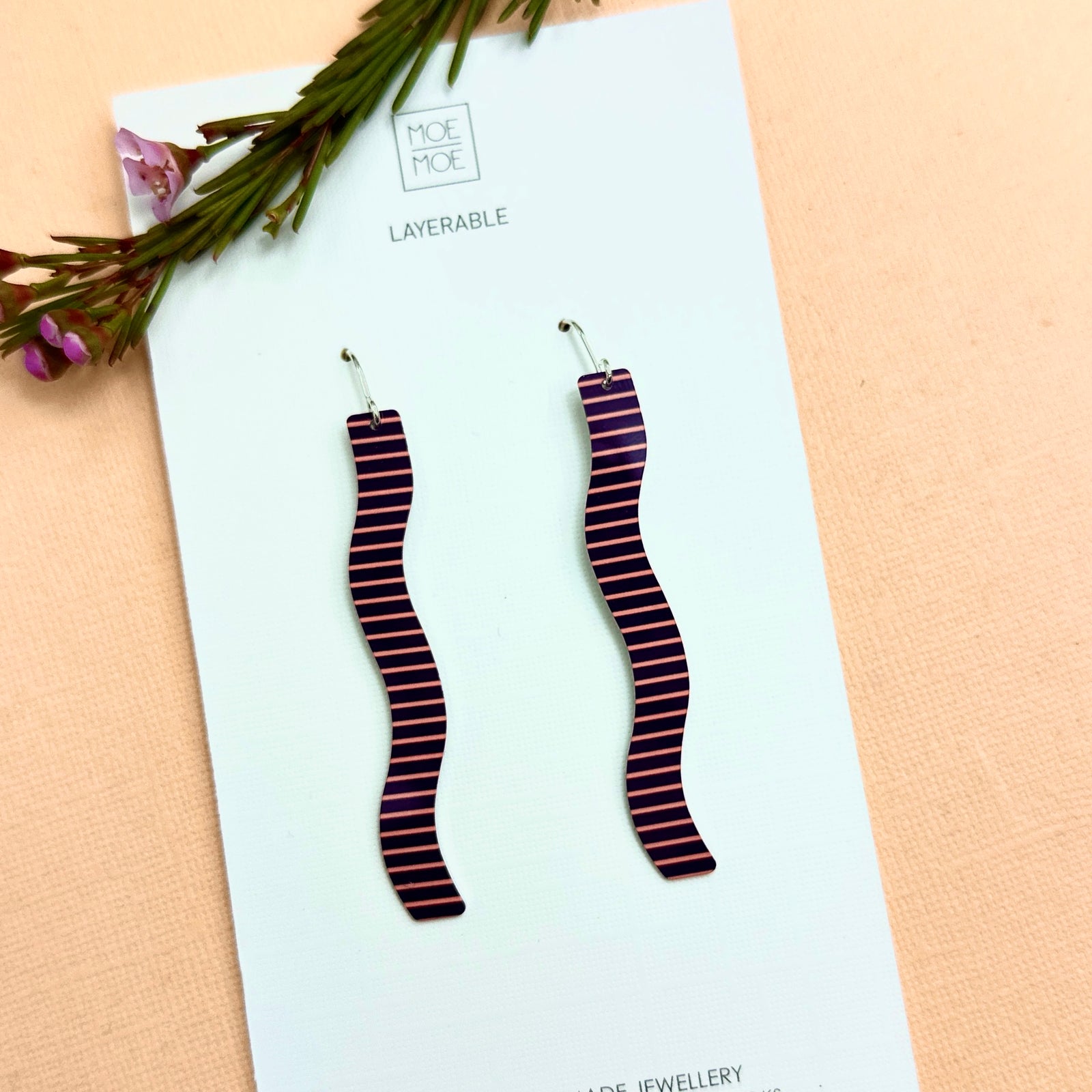 Squiggle wine and peach drop